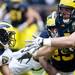 Offensive linesman Ben Braden blocks during the Michigan spring football game on Saturday, April 13. AnnArbor.com I Daniel Brenner